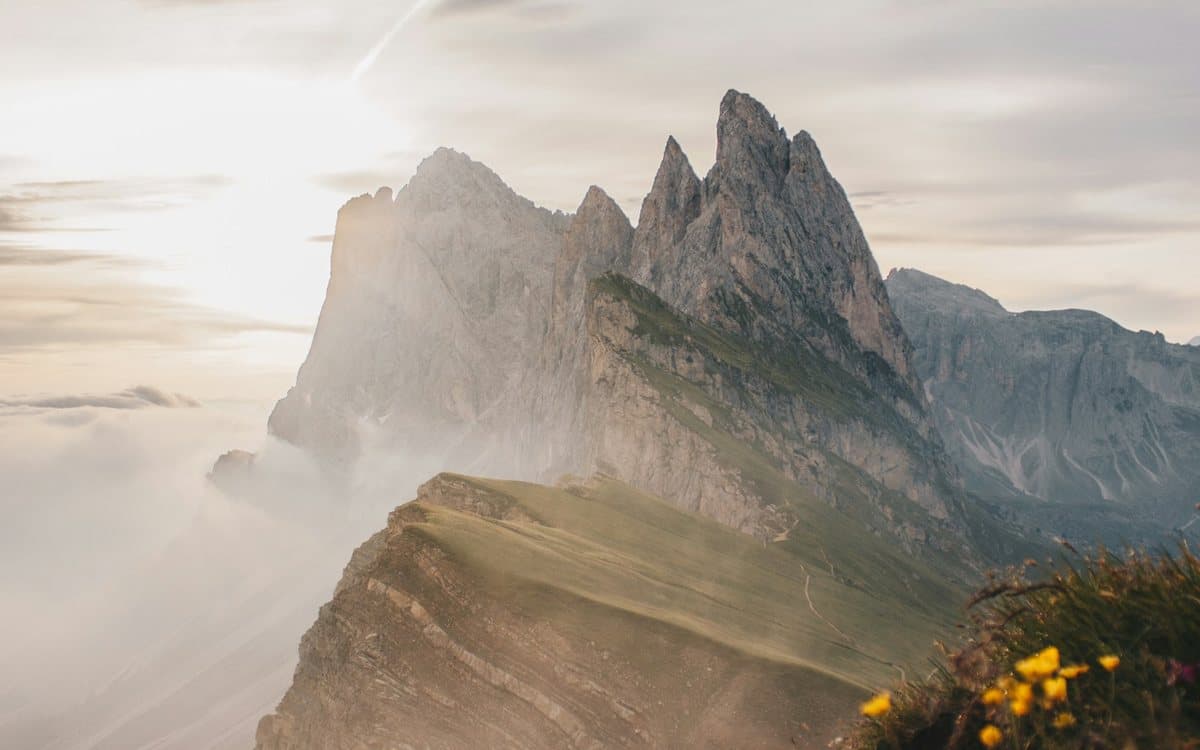 The jagged Seceda ridge rising out of morning cloud